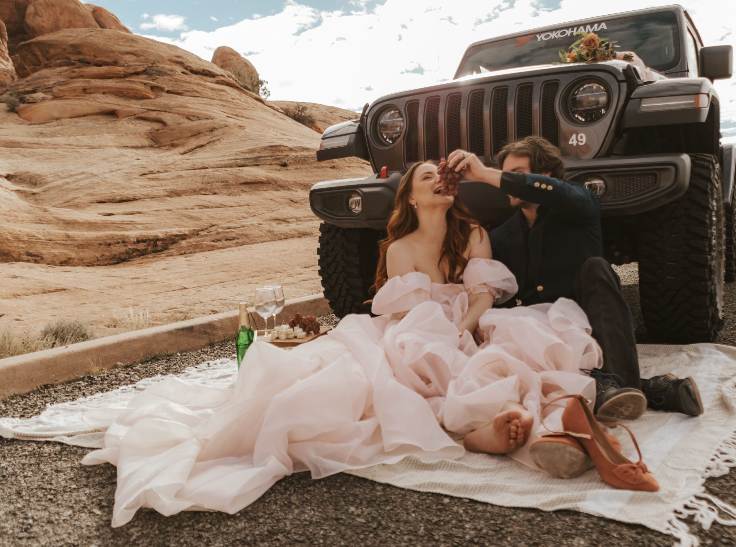 Couple having picnic after eloping in Moab